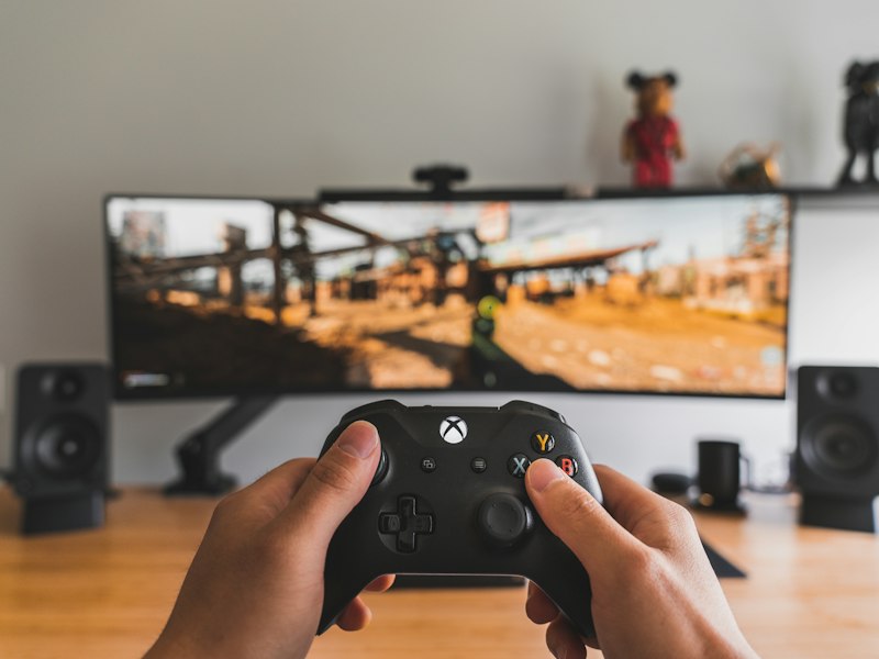 Controller and notes on a pink desk